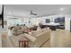 Spacious living room with hardwood floors, comfortable seating, and an open floor plan at 3154 Hugh Bennett Dr, Johns Island, SC 29455