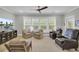 Inviting living room with comfortable armchairs, a large window, and stylish decor for relaxation at 3154 Hugh Bennett Dr, Johns Island, SC 29455