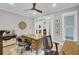 Bright home office with a large desk, hardwood floors, and natural light at 3154 Hugh Bennett Dr, Johns Island, SC 29455