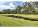 Scenic pond and expansive green space offer a tranquil community setting at 3154 Hugh Bennett Dr, Johns Island, SC 29455