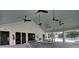 Pool house interior with picnic tables and fans overlooking the large pool at 3154 Hugh Bennett Dr, Johns Island, SC 29455