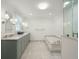 Elegant bathroom with double vanity, marble countertops, and a luxurious soaking tub at 32 Church St, Charleston, SC 29401