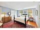 Charming bedroom with wood floors, natural light, and beautiful antique decor at 32 Church St, Charleston, SC 29401