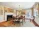 Elegant dining room with chandelier, fireplace, and hardwood floors at 32 Church St, Charleston, SC 29401
