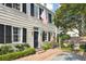 Charming home exterior featuring classic architecture and an American flag at 32 Church St, Charleston, SC 29401