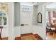 Bright foyer with hardwood floors and classic white trim at 32 Church St, Charleston, SC 29401