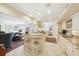 Spacious kitchen flows into the living area, with granite counters and stainless appliances at 32 Church St, Charleston, SC 29401
