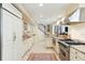Spacious kitchen with white cabinets, stainless steel appliances, and tile flooring at 32 Church St, Charleston, SC 29401