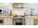 Gourmet kitchen boasts a Viking range, granite counters, and ample storage space at 32 Church St, Charleston, SC 29401