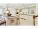 Open kitchen with breakfast bar, granite counters, and a full suite of appliances at 32 Church St, Charleston, SC 29401