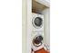 Efficient laundry area features stacked washer and dryer, optimizing space in the home at 32 Church St, Charleston, SC 29401