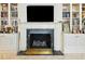 Living room with marble fireplace, built-in bookshelves, and decorative accents at 32 Church St, Charleston, SC 29401