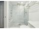 Modern shower featuring frameless glass, dual shower heads, and marble tile design at 32 Church St, Charleston, SC 29401