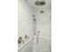 Luxurious shower featuring dual shower heads and elegant marble tiling at 32 Church St, Charleston, SC 29401
