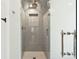 Modern tiled shower featuring a glass door, rain shower head, and built-in niche at 32 Church St, Charleston, SC 29401