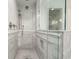 Marble tiled walk-in shower with rainfall shower head and bench at 32 Church St, Charleston, SC 29401