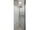 Modern shower featuring frameless glass, dual shower heads, and marble tile design at 32 Church St, Charleston, SC 29401