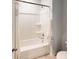 Clean white bathroom features a bathtub with shower, white tile, and ample space at 325 Pine Crest View, Summerville, SC 29486