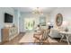 Open-concept living area seamlessly connects the dining space to the living room with sliding doors to the outside at 325 Pine Crest View, Summerville, SC 29486