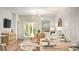 Open-concept living area seamlessly connects the dining space to the living room with sliding doors to the outside at 325 Pine Crest View, Summerville, SC 29486