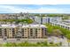 Aerial view showcasing modern apartment buildings, city skyline, and surrounding neighborhood at 33 Calhoun St # 123, Charleston, SC 29401