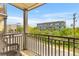 Relax on this balcony with stylish wicker chairs and beautiful cityscape views in the background at 33 Calhoun St # 123, Charleston, SC 29401