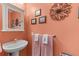 Stylish powder room with charming vanity, decorative mirror, and unique design elements at 33 Calhoun St # 123, Charleston, SC 29401