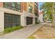 Elegant condominium building entrance featuring a gated entry and a classic brick and stucco facade at 33 Calhoun St # 123, Charleston, SC 29401