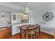 Dining area with seating for six with views of the kitchen and living space at 33 Calhoun St # 123, Charleston, SC 29401