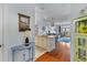 Inviting entryway with stylish decor leading into a modern kitchen and living area at 33 Calhoun St # 123, Charleston, SC 29401