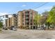 Beautiful building exterior featuring multiple balconies, a well-kept lawn and street-side parking at 33 Calhoun St # 123, Charleston, SC 29401