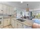 Modern kitchen with granite countertops, stainless steel sink, and open layout at 33 Calhoun St # 123, Charleston, SC 29401