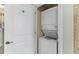 Conveniently located laundry closet with a stacked washer and dryer unit at 33 Calhoun St # 123, Charleston, SC 29401