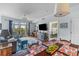 Open floor plan with dining and living areas, plus balcony access and bedroom views at 33 Calhoun St # 123, Charleston, SC 29401