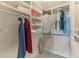 Organized walk-in closet with shelving and rods, offering ample storage space for clothing and linens at 33 Calhoun St # 123, Charleston, SC 29401