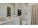 Bright bathroom with white cabinets, modern fixtures, shower with curtain and artistic decor at 331 Pine Crest View, Summerville, SC 29486