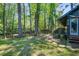Lush backyard, featuring a dock, steps to the back door, a quaint seating area, and a view of the water at 3389 Prices Bridge Ln, Walterboro, SC 29488
