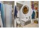 Compact bathroom with a shower, toilet, sink, and round mirror at 3389 Prices Bridge Ln, Walterboro, SC 29488