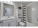 Bright bathroom featuring a vanity with white quartz countertop, modern fixtures, and a shower-tub combo at 349 Long Pier St, Summerville, SC 29486