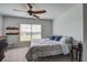 Comfortable bedroom with a ceiling fan, shelves, and a window offering natural light and neighborhood views at 349 Long Pier St, Summerville, SC 29486