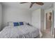 Bedroom with neutral walls, a cozy bed with decorative pillows, and an airy feel with a ceiling fan at 349 Long Pier St, Summerville, SC 29486