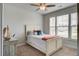 Cozy bedroom featuring neutral decor, a ceiling fan, and a bright window, creating a relaxing atmosphere at 349 Long Pier St, Summerville, SC 29486
