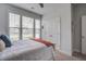 Bright bedroom featuring a large window, light-colored walls, and closet creating a clean and modern feel at 349 Long Pier St, Summerville, SC 29486