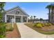 Community clubhouse featuring a pool, palm trees, and a sidewalk leading to the building at 349 Long Pier St, Summerville, SC 29486