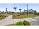 Community common area featuring a walkway and playground surrounded by palm trees and well-maintained landscaping at 349 Long Pier St, Summerville, SC 29486