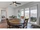 Cozy dining area with patio access, showcasing hardwood floors and natural light at 349 Long Pier St, Summerville, SC 29486