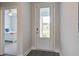 Bright entryway featuring hardwood floors and a view into a bedroom, showcasing the home's interior layout at 349 Long Pier St, Summerville, SC 29486