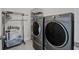 Efficient laundry room with modern washer and dryer set, providing convenience and functionality at 349 Long Pier St, Summerville, SC 29486