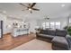 Spacious open-concept living area with wood floors, ceiling fans, and a seamless flow to the kitchen and dining area at 349 Long Pier St, Summerville, SC 29486