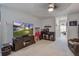 Inviting living room with a TV, console, and decorative bar setup, perfect for entertainment at 349 Long Pier St, Summerville, SC 29486
